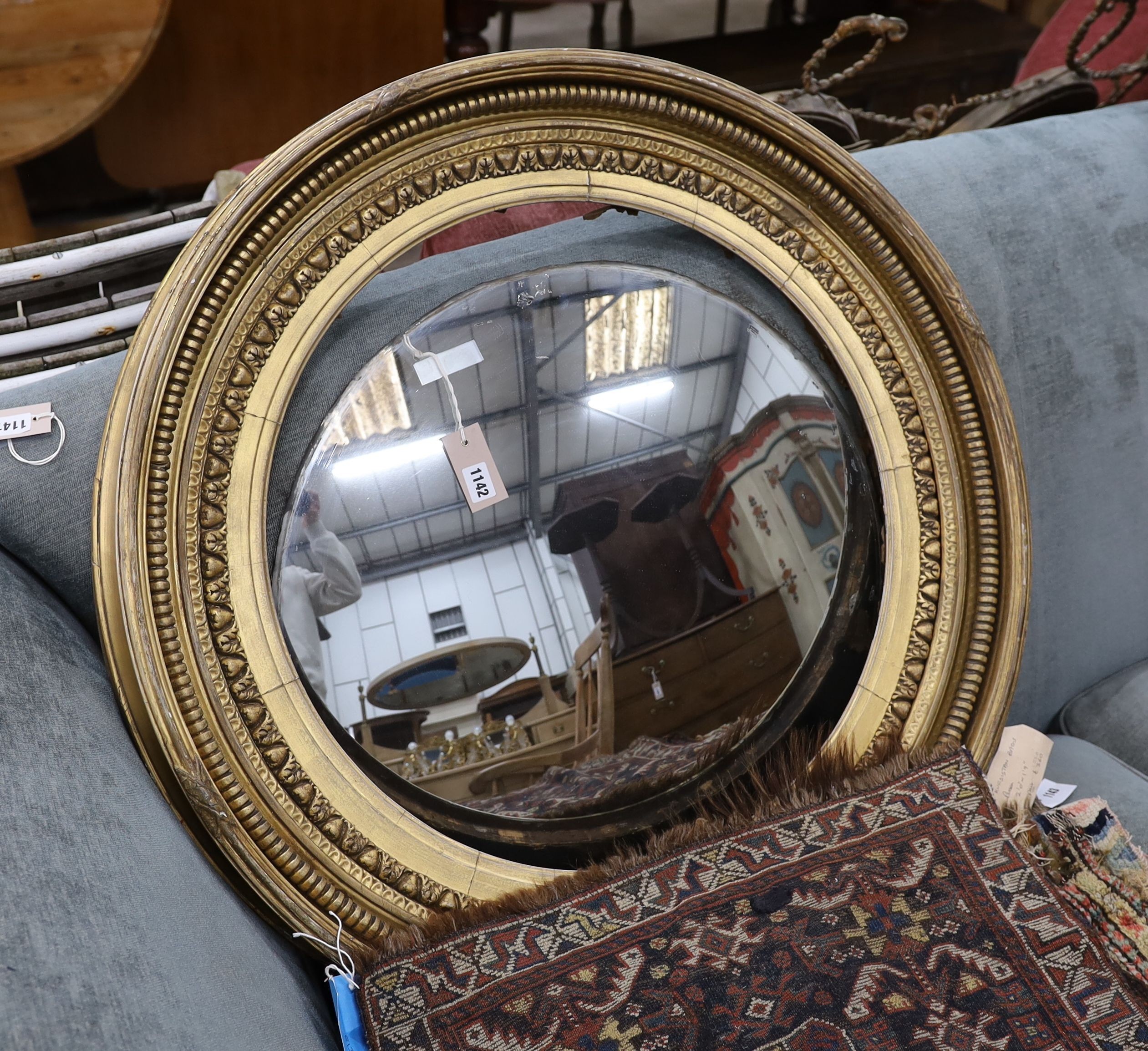 A large Regency circular giltwood and gesso convex wall mirror, diameter 86cm